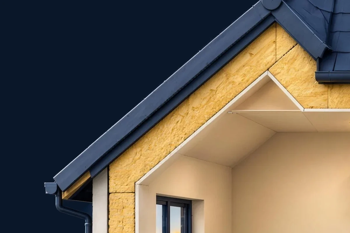 A cutaway sloping roof and outer wall, both with a thick layer of insulation.